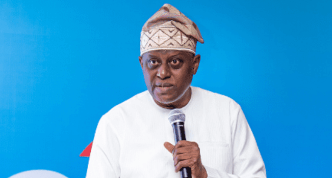 Government official addressing stakeholders at a BusinessCBN forum, urging development finance institutions to support Nigeria’s ongoing economic reforms.