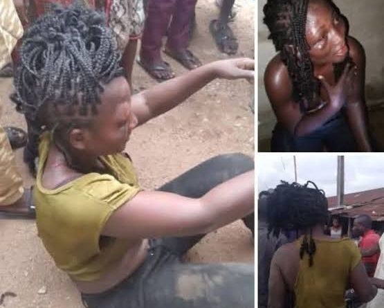 A crowd gathered around a woman during a tense incident after she was allegedly found with the lifeless body of a child, while residents and security personnel tried to control the situation.
