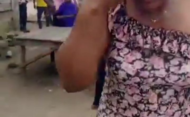 A crowd surrounds a woman at Effurun Market in Delta State after she was allegedly caught attempting to steal another shopper's handbag, as seen in a viral video.